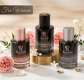 Three Rosebelle Fragrances perfume bottles displayed on a white surface with pink roses and gold accents. A dark banner at the top reads 'For Women'.